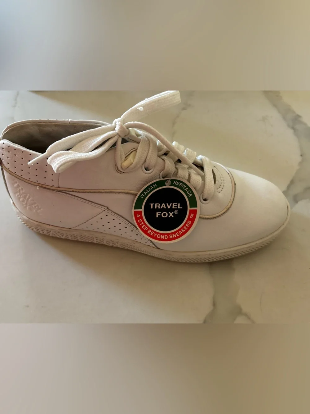 Travel Fox white sneakers size 7 back tab has a tear